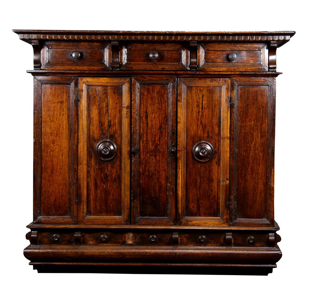 A French Provincial oak cabinet circa 1740: A French Provincial oak cabinet circa 1740, the outset rectangular top over three side by side drawers surmounting the lower doors, and rising on a molded base, 55"w x 22"w x 49"h