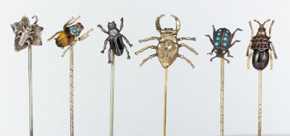 (Lot of 6) Multi-stone, paste, enamel, sterling silver,: (Lot of 6) Multi-stone, paste, enamel, sterling silver, silver, metal insect stickpins Including 1) beetle on a leaf silver stickpin (marked JJ): 1) tigers eye, glass, silver beetle stickpin; 1) paste