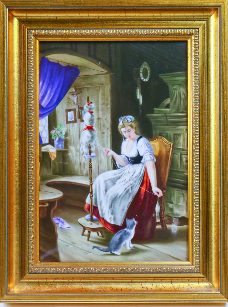 A KPM porcelain plaque depicting an interior scene: A KPM porcelain plaque depicting an interior scene, centered with a seated girl, at her feet a cat at play, verso with KPM impressed mark, plaque sight 8.75"h x 5.75"w, overall 11.75"h x 9"w