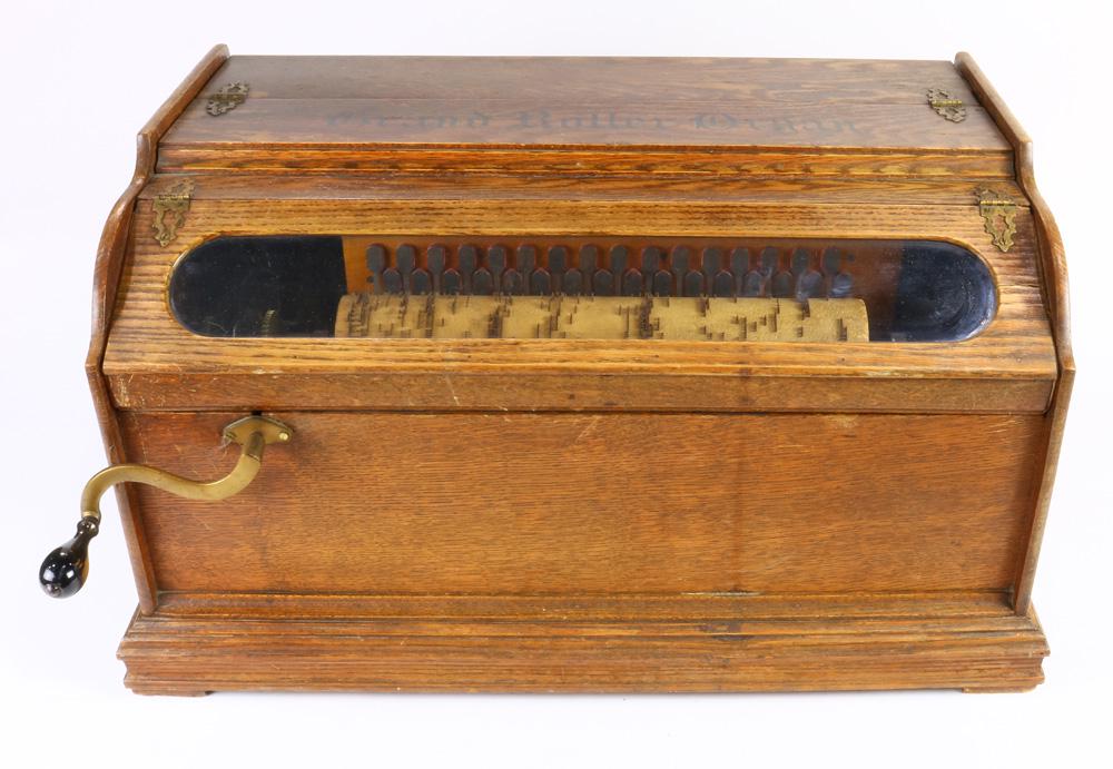 An Autophone Co. Grand Roller Organ: An Autophone Co. Grand Roller Organ, late 19th / early 20th century, with crank, and seven 13" rolls, case 13"h x 24"w x 16"d