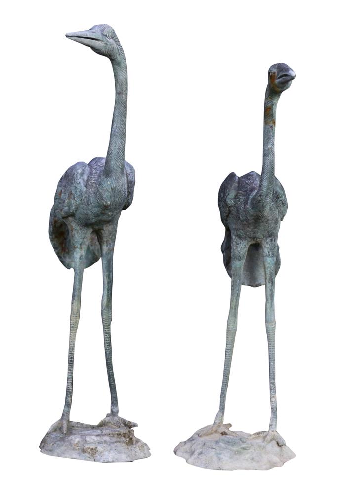 A Pair of small metal cranes: A Pair of small metal cranes, each depicted standing, largest 27"h Provenance: The Estate of Robin Leach, proceeds to benefit charities including the Cleveland Clinic/Lou Ruvo Center for Brain Health,