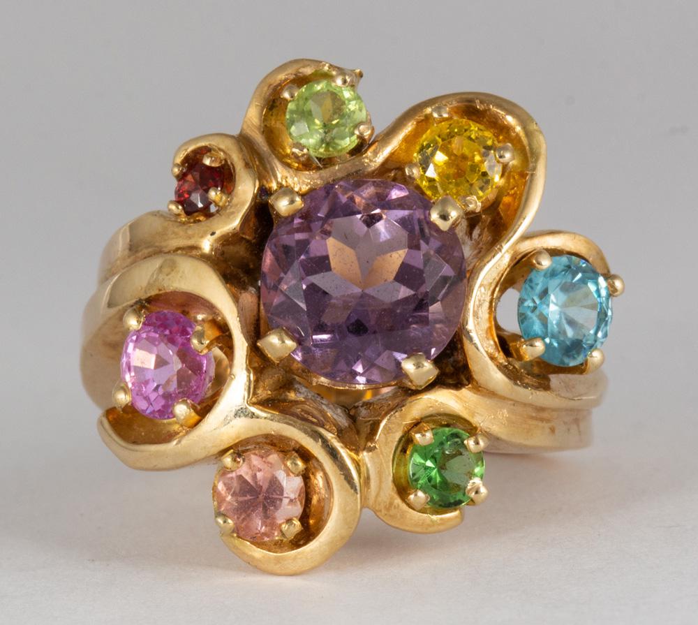 Multi-stone, 14k yellow gold ring: Multi-stone, 14k yellow gold ring Centering (1) round-cut amethyst, weighing approximately 1.60 cts., surrounded by (1) round-cut blue zircon, garnet, citrine, tourmaline, peridot, sapphire and topaz,