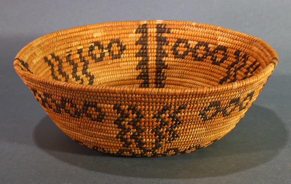American Indian Mono coiled basket: A Native American Indian Mono coiled basket, Central California, with a wide round rim and tapering body to a flat bottom, ornately decorated with three vertical bands and repeating dot patterning, 3"