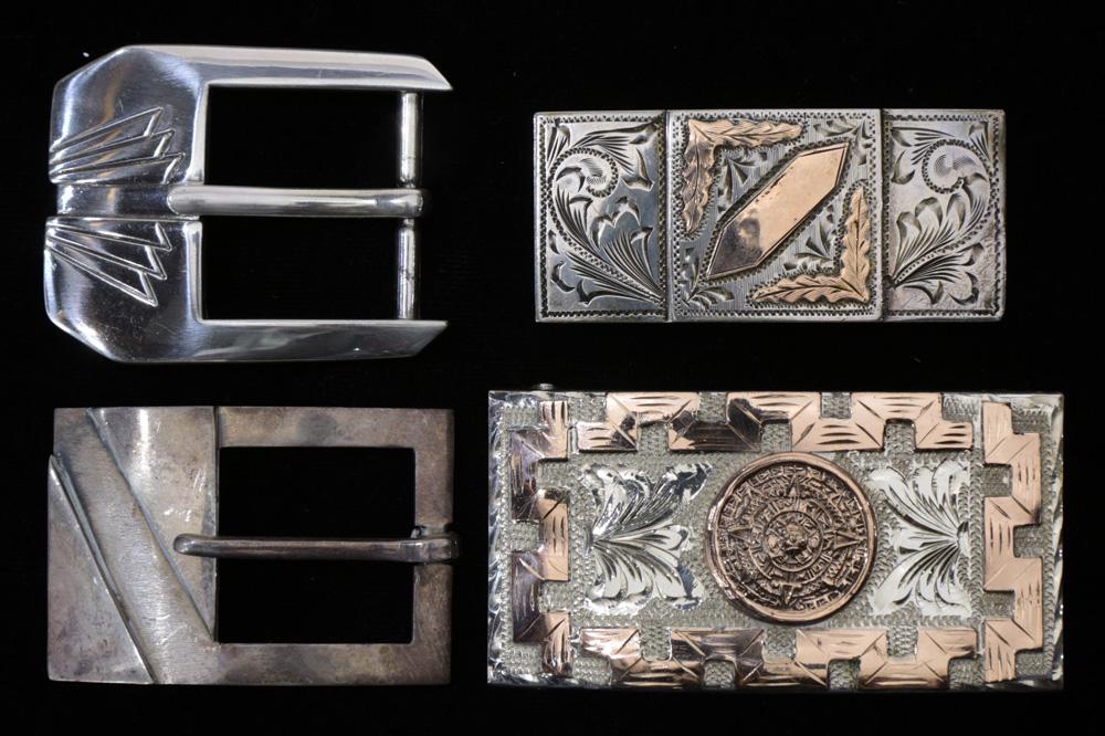 4 Mexican silver belt buckle lot: 2"Sterling" mixed: (lot of 4) A Mexican silver belt buckle lot: (2) Mexican "Sterling" mixed metal buckles, one centering an Aztec medallion; a third marked "Silver" and "A.M."; a fourth unmarked, total weight 173 grams