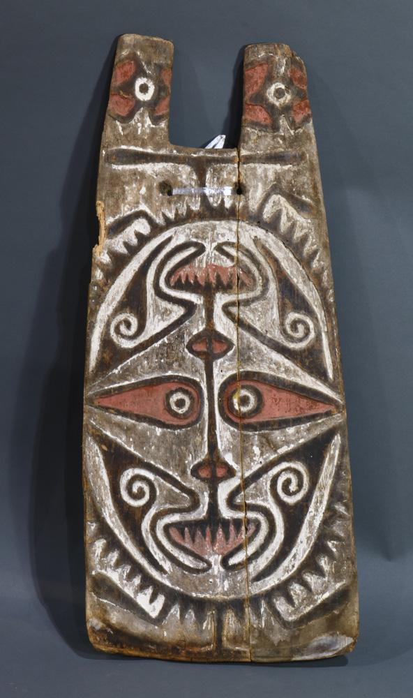 South Coast Papua New Guinea shoulder shield: Papuan Gulf, South Coast Papua New Guinea, shoulder shield to ward off arrows coming from the side, cracked through vertically near center then natively repaired, 29"h x 13"w; Provenance: Richard I.M.