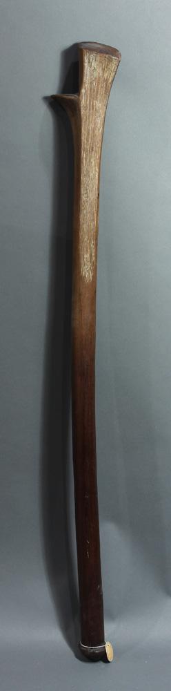 A Fiji, Polynesia, rootstalk club: A Fijiian rootstalk war club, accented with long, incised striations, 39"h; Provenance: Richard I.M. Kelton Collection, Marina del Rey, California