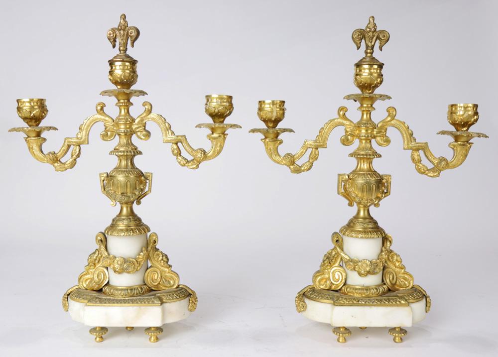 A Pair of Louis XV style ormolu mounted candelabra: Pair of Louis XV style ormolu mounted candelabra, each having two lights, with scrolled arms, above a hard stone base, 13"h Provenance: The Estate of George Germany, Berkeley, CA.