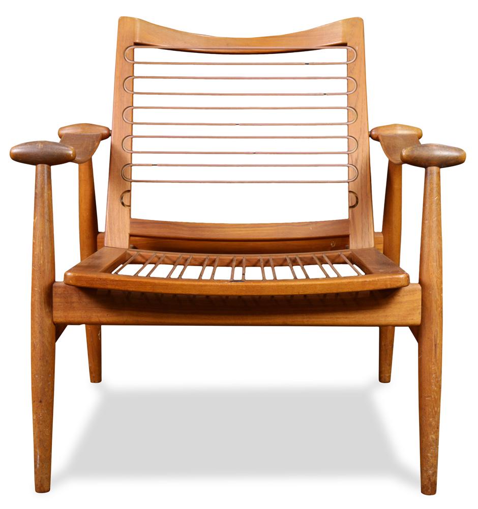 A Danish Modern Finn Juhl for John Stuart armchair: A Danish Modern Finn Juhl for John Stuart Model 133 teak armchair, having a shaped back, above tapered legs, with label for John Stuart Inc., 30"h x 29"w x 31"d