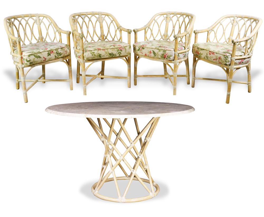 A McGuire, San Francisco, dining room suite: (lot of 5) McGuire, San Francisco, dining room suite, consisting of a table having a circular marble top, 29"h x 48"dia., and four armchairs, each having a faux bamboo frame, 32"h