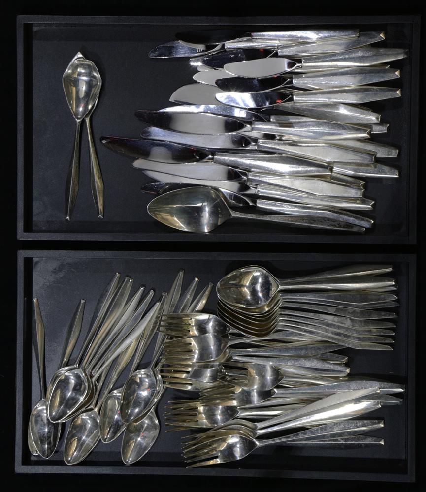 A Reed & Barton Diamond sterling flatware set, designed: (lot of 69) A Reed & Barton Diamond sterling flatware set, designed by Gio Ponti in 1958: (9) dinner forks, 7.5"l; (10) dinner knives with plated blades 9"l; (11) salad forks; (10) place spoons; (15)
