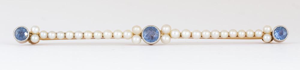 Sapphire, seed pearl, 14k yellow gold bar brooch: Sapphire, seed pearl, 14k yellow gold bar brooch Featuring (3) round-cut sapphires, weighing a total of approximately 0.35 ct., accented by (28), 2.0 mm, seed pearls, set in a 14k yellow gold bar moun