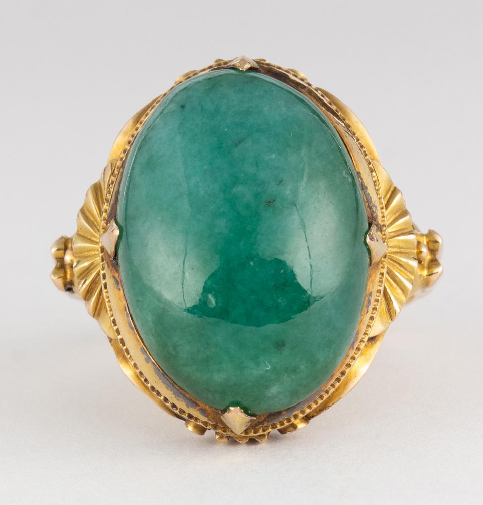 Jadeite, 18k yellow gold ring: Jadeite, 18k yellow gold ring Featuring (1) oval jadeite cabochon, measuring approximately 19 X 12 mm, set in an 18k yellow gold mounting, size 4.5, gross weight 6.0 grams