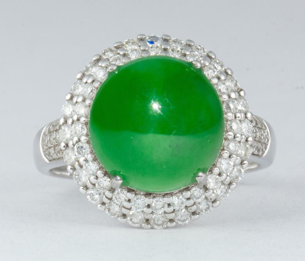 Jadeite, diamond, 18k white gold ring: Jadeite, diamond, 18k white gold ring Centering (1) round, jadeite cabochon, accompanied by a Gemological Institute of America (GIA) Jade Report #2205263069, Dated May 16, 2019, Stating Jadeite Jade N