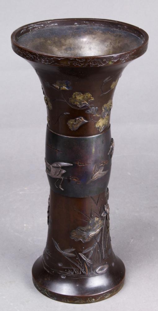 Japanese Patinated Bronze Vase: Japanese patinated bronze vase, late Edo-Meiji period, stick neck with flared top, with raised cranes, double gourd and lotus in gilt and silver, approx. 9.75"h