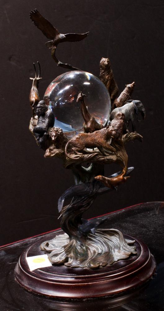 Conservation International Guardians of the World: Conservation International Guardians of the World crystal ball, having a patinated metal body with different animal, bird, and sealife figures, surrounding the spherical ball, underside with Conservat