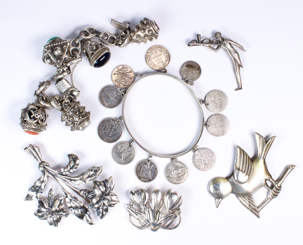 (Lot of 6) Multi-stone, glass, sterling silver, silver: (Lot of 6) Multi-stone, glass, sterling silver, silver brooches and bracelets Including 1) bloodstone, carnelian intaglio, glass fob silver, metal charm bracelet; 1) coin form charm silver, metal, ban