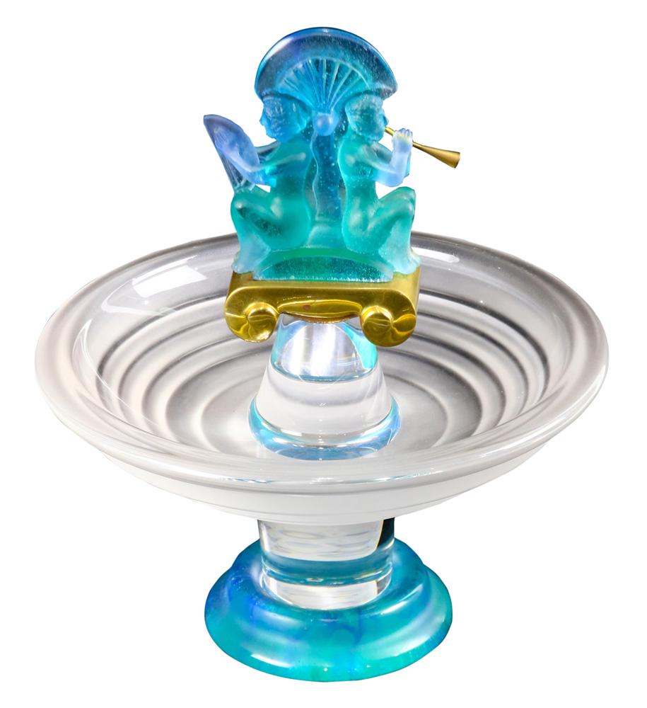 A Daum France pate de verre compote: A Daum France pate de verre compote, having a figural finial in the Classical taste, with a gilt capital, above the frosted and graduated bowl rising on a clear standard and terminating on a circular 