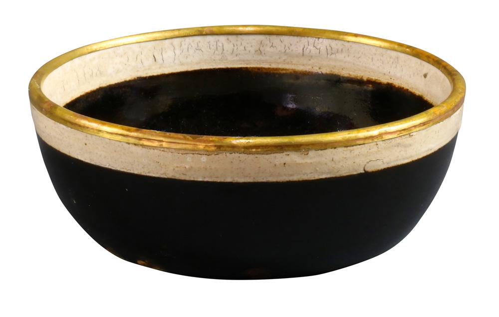 A cizhou style white-rimmed black-glazed Washer: A cizhou style white-rimmed black-glazed washer, deep curving sides covered with a black glaze, the rim with a white slip, the flat base unglazed revealing the pale buff body, the rim mount in a gilt-