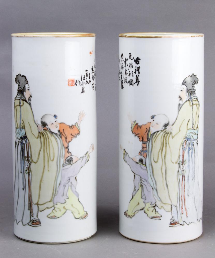(lot of 2) A Pair of Qianjiangcai Cylindrical Vases: (lot of 2) A pair of Qianjiangcai cylindrical vases, both decorated with scholar and children, inscribed " imitation of the Yuan style", signed wang jiemei (1843-1923), size: 4.75"w x 11.25"h