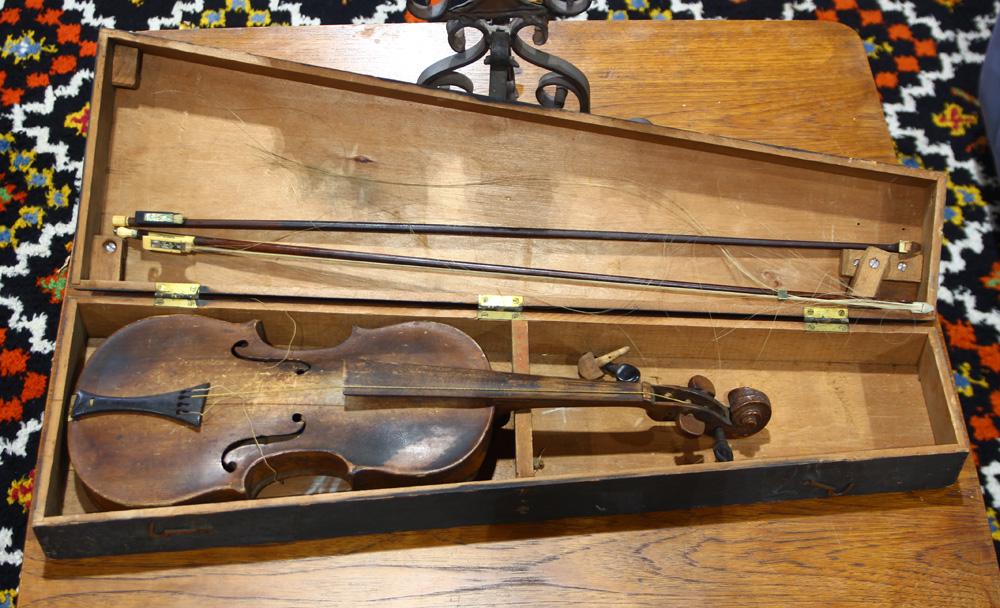 Violin in wooden case with two bows, one marked (1 of 2)