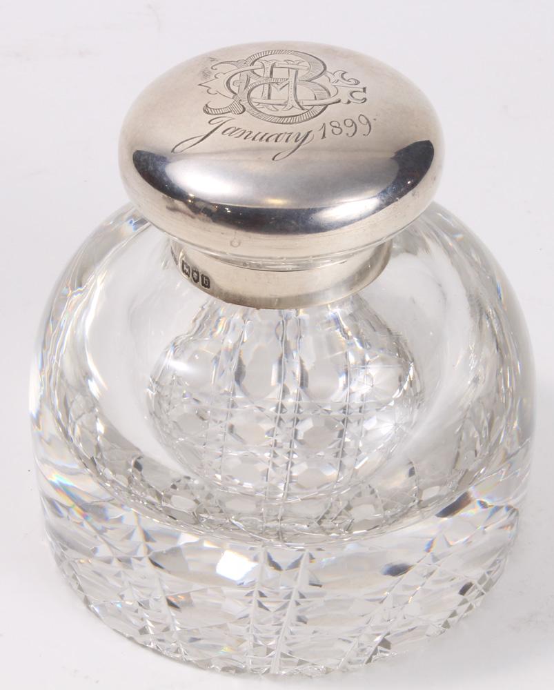 An inkwell with sterling lid and crystal base (1 of 2)