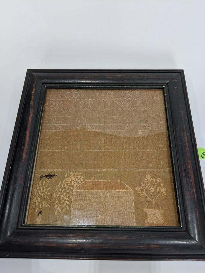 A Framed needlepoint sampler (1 of 2)