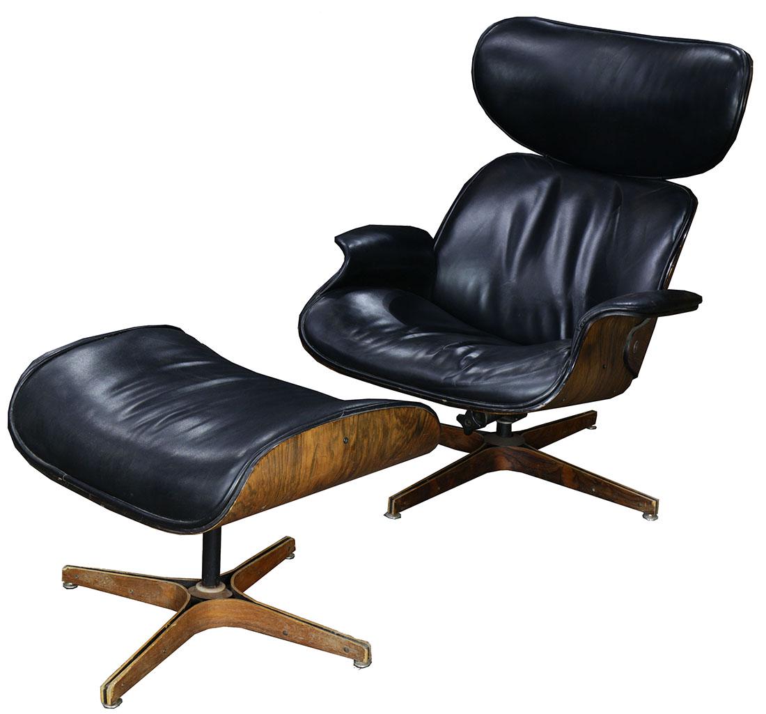 A Mid Century Plycraft laminated rosewood lounge chair: A Mid Century Plycraft laminated rosewood lounge chair and ottoman designed by George Mulhauser, having black upholstery and rising on a rosewood propeller base, chair: 38"h x 31"w x 22"d ottoman: 18"