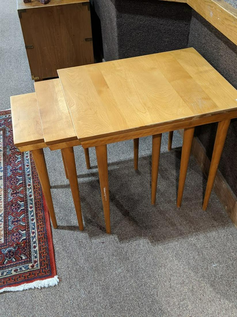 A set of Mid Century Russel Wright for Conant Ball: A set of Mid Century Russel Wright for Conant Ball nesting tables, each having a rectangular top and rising on tapered legs, 24"h x 20"w x 26"d