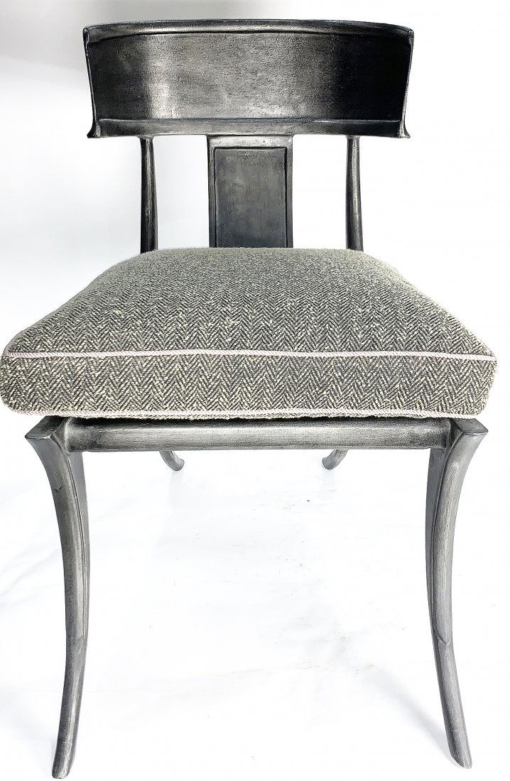 A Michael Taylor patinated Klismos chair: A Michael Taylor patinated Klismos chair, having a contoured crest above the single splat, the seat with a loose cushion, and rising on outswept legs, 35"h