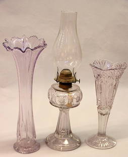 Depression amethyst glass: Two depression glass amethyst vases, and an oil hurricane lamp with chimney, 18''h