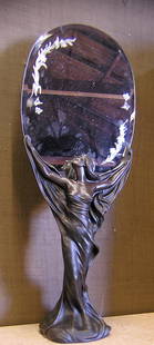 Art Nouveau style figural mirror: Composition Art Nouveau style figural mirror depicting a beauty supporting an etched, beveled mirror