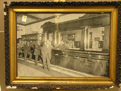 Framed b/w photograph, bar scene: Framed black and white photograph, depicting proprietors of a bar