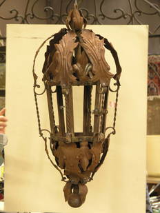 Hanging wrought iron lanterns: Pair of hanging wrought iron lanterns