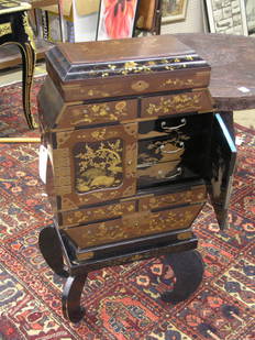 Japanese Lacquer Cabinet: Japanese lacquer cabinet with lidded top compartment above a series of drawers and a two door cabinet on a later black lacquer stand approximately 38''h x 22''w x 11''d