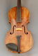 An antique violin, having a maple body with spruce top,