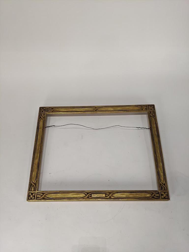 Hand-carved arts and crafts frame, Karl Schmidt: A hand carved Arts and Crafts frame executed by Karl Schmidt (American 1890-1962), central plaque signed by Schmidt, overall 14"h x 18"w rabbet 12.25" x 16.25" Provenance: Sale to Benefit the Oakland 