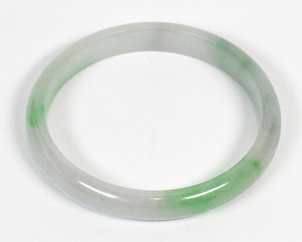 Jadeite bracelet: Jadeite bracelet The carved jadeite bangle, measuring approximately 8.9 mm in width, 52.9 mm widest internal diameter