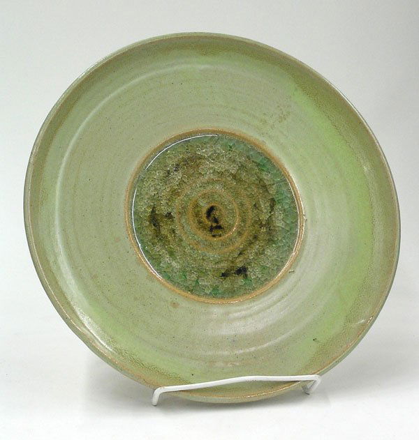 Jade Snow Wong Stoneware plate: Jade Snow Wong Stoneware plate with green glaze and deep crazed glaze in central area, signed ''Jade Snow Wong-San Francisco'', 13''dia.