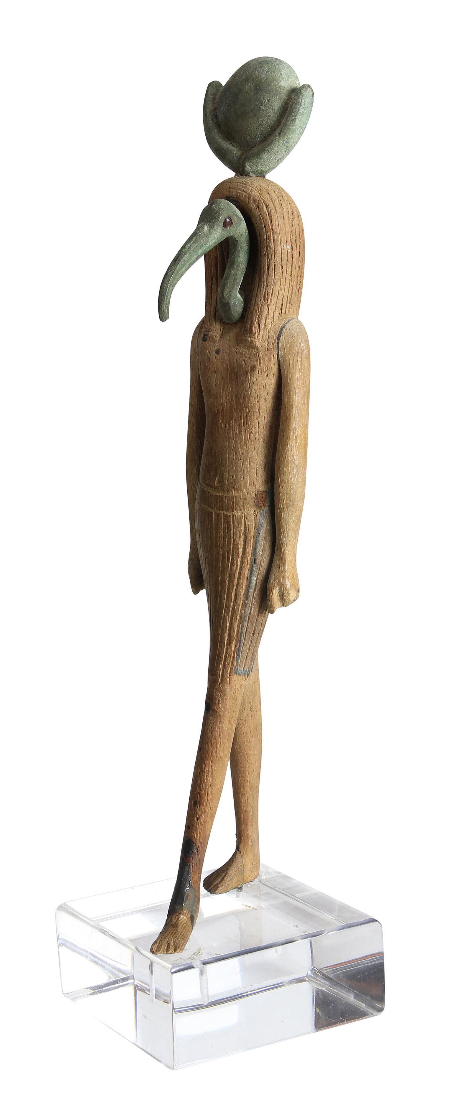 An ancient Egyptian bronze and wood figure of Thoth: An ancient Egyptian bronze and wood figure of Thoth 715-332 B.C.E, 10"h Provenance: Los Robles Gallery, Palo Alto,CA