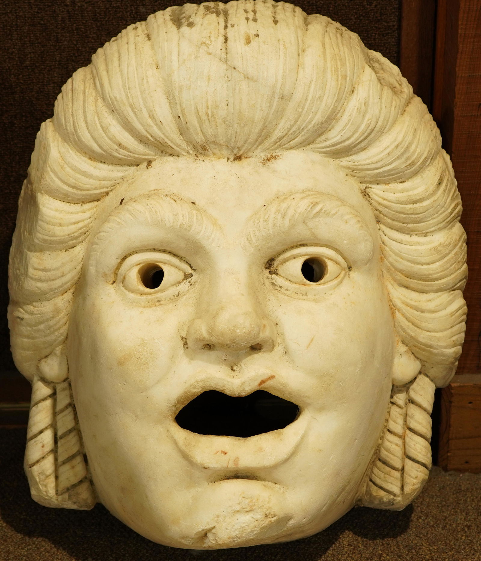 A Classical style carved marble fountain mask form: A Classical style carved marble fountain mask form spout circa 1890, the carved form used as a fountain head, having a mask form with mouth open, 24"h Provenance: Estate of Frank J. Caufield (San Fran