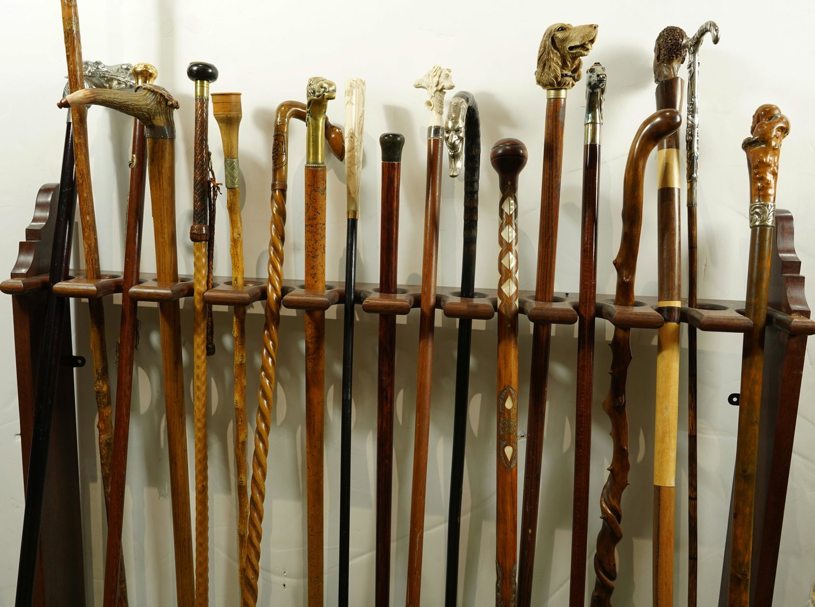(lot of 20) A mostly Victorian walking stick collection: (lot of 20) A mostly Victorian walking stick collection, including a sterling Art Nouveau example, a dice example, figural examples including horses, English presentation example, a carved Shillelagh,