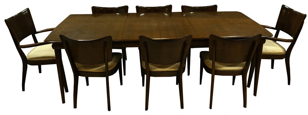 A Heywood Wakefield dining suite: (lot of 9) Heywood Wakefield dining room suite, consiting of a dining table, having a shaped rectangular top with two 15"l leaves, and rising on tapered legs, 29"h x 91"w x 42"d, together with six sid