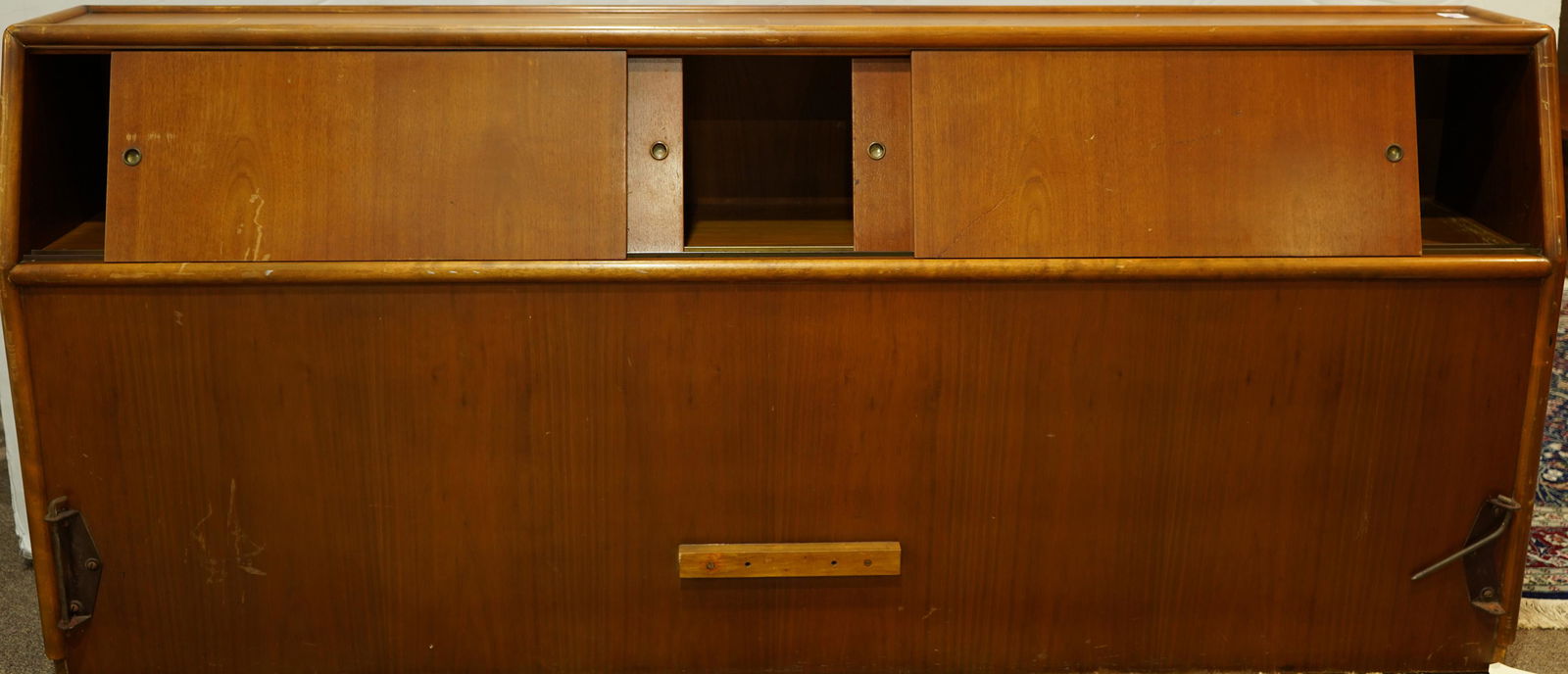 A T.H. Robsjohn-Gibbings headboard: T.H. Robsjohn-Gibbings headboard, having a rectangular top, above two sliding doors, the reverse marked with a Widdicomb label, 36.5"h x 81"w x 14.5"d