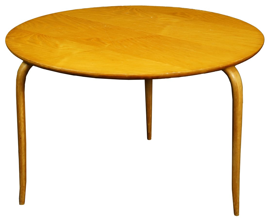 A Bruno Mathsson (Swedish, 1907-1988) for Karl Mathsson: Bruno Mathsson (Swedish, 1907-1988) for Karl Mathsson Annika table, having a circular top, above tapered legs, with manufacturer's brand to underside, 19"h x 29.5"dia.