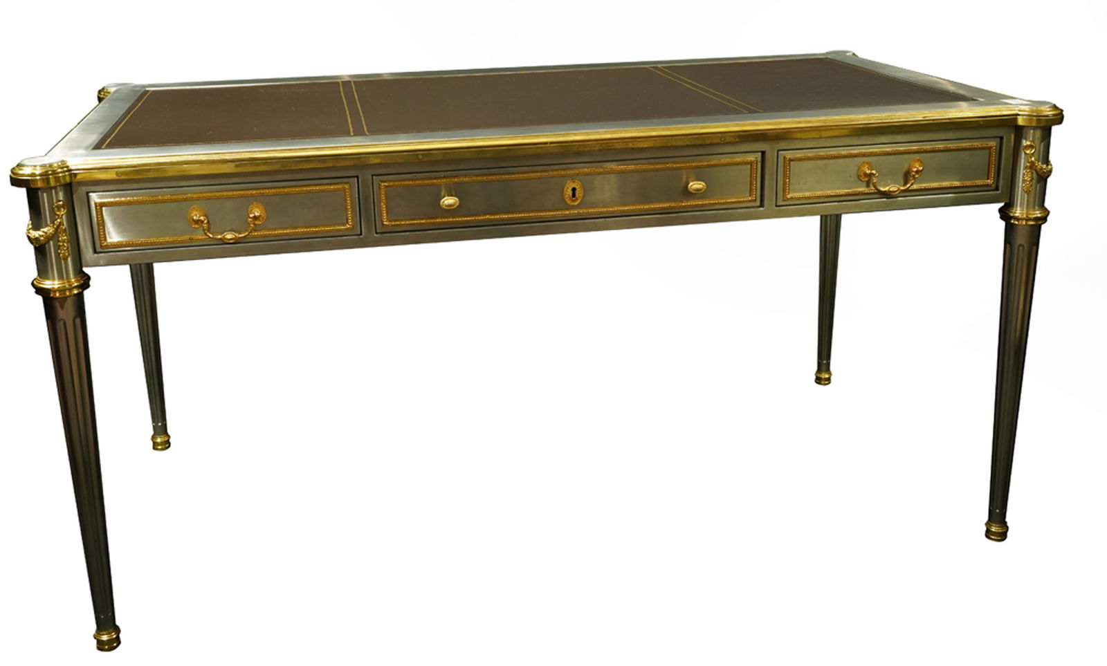 A John Vesey desk John Vesey: A John Vesey desk John Vesey, Inc. circa 1960, executed in stainless steel, nickel-plated brass, leather, and brass, having an inset leather top with highly polished nickel plated brass mounts, 30.5"h