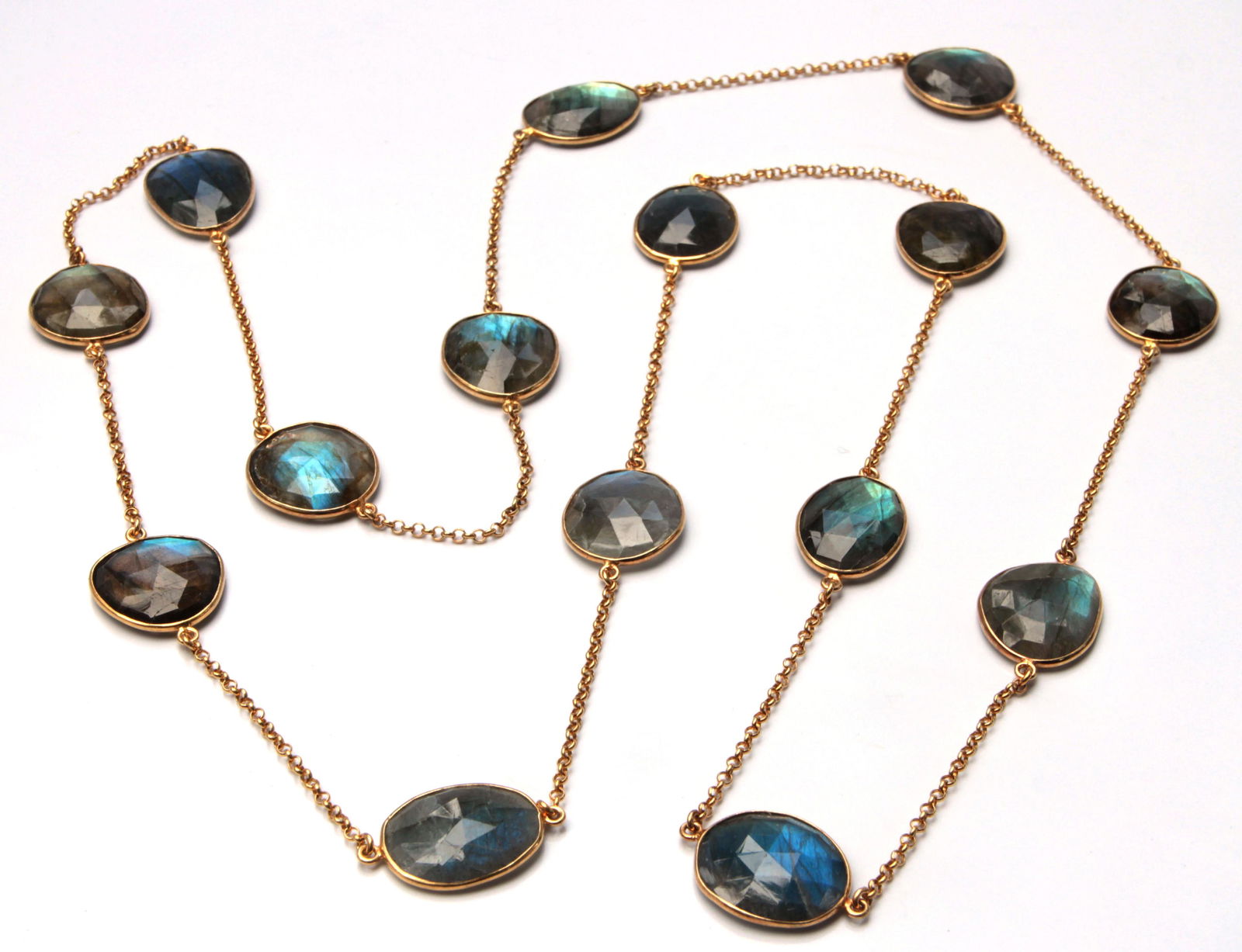 Labradorite, silver gilt link necklace: Labradorite, silver gilt link necklace Composed of (15) irregular faceted topped labradorite cabochons, measuring approximately 23.0 X 18.0 X 4.9 mm, set in and linked in silver gilt, forming a contin