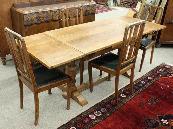 Oak draw-leaf refectory table: Oak draw-leaf refectory table on double pedestal base, together with 4 oak side chairs having green leather seat cushions, 30.5''h x 49''w x 30''d with two 15''w draw leaves, chairs 39''h x 17''d x 20