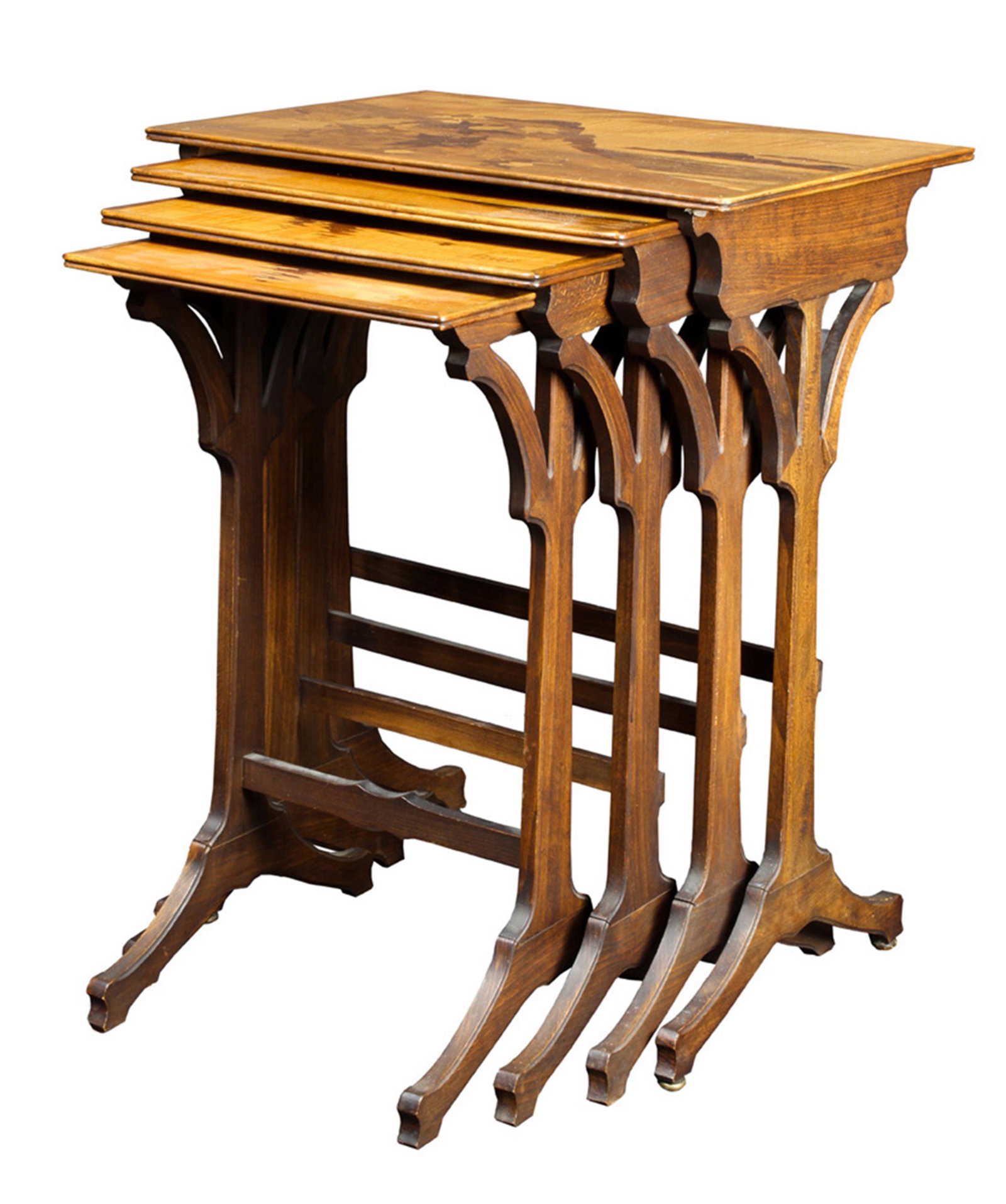 A group of Emile Galle nesting tables: (lot of 4) A group of Emile Galle marquetry decorated nesting tables, the graduated group of four each displaying a naturalistic scene, the largest depicting floral sprays at a rocky out cropping, the