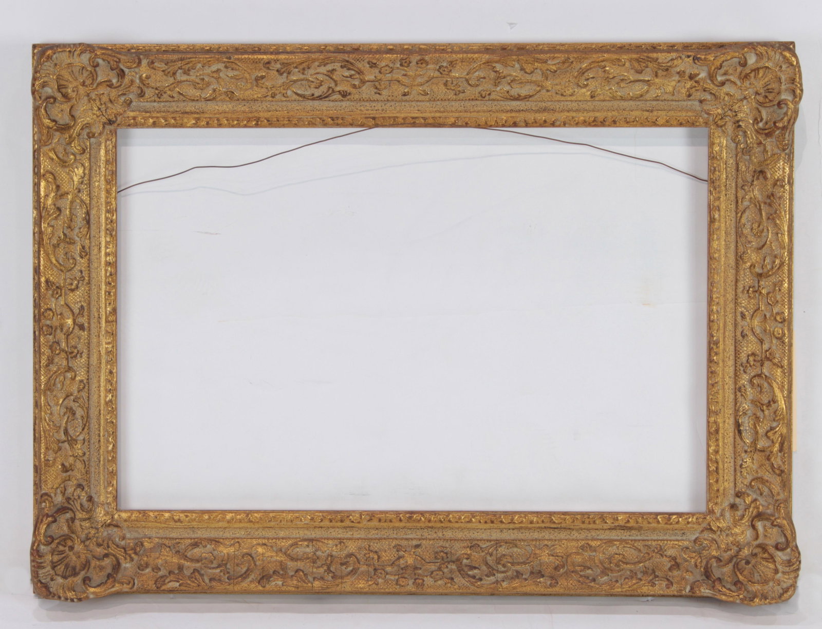 A Newcomb Macklin Barbizon Style period picture frame: A Newcomb Macklin Barbizon Style period picture frame, overall 19.5"h x 27.5"w rabbet 14.75"h x 21.75"w