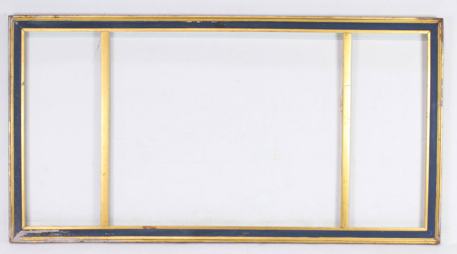A hand carved Arts and Crafts triptych frame executed: A hand carved Arts and Crafts triptych frame executed by Karl Schmidt (American 1890-1962), executed in three parts, overall 28.5"h x 55"w the sides rabbet 25"h x 10.5"w, central panel rabbet 25"h x 3